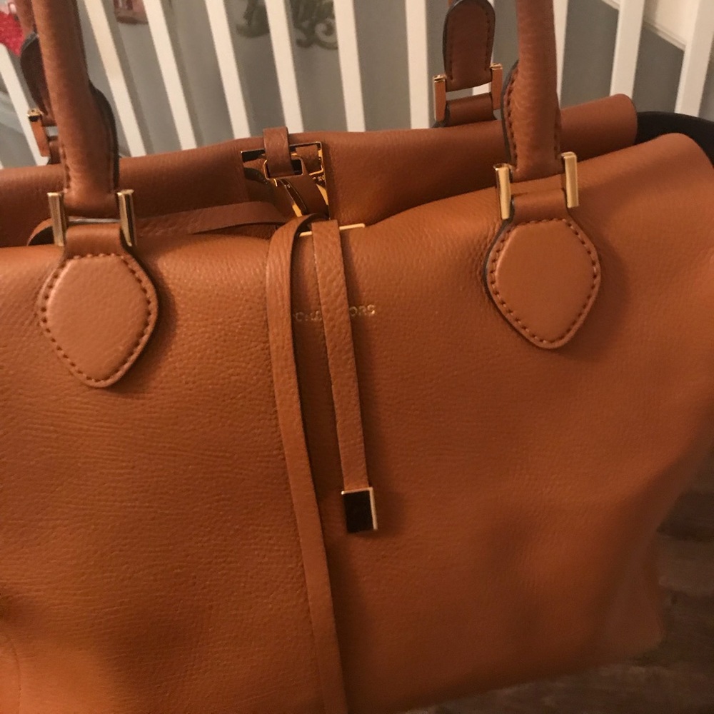 Michael Kors purse with originally sleeve